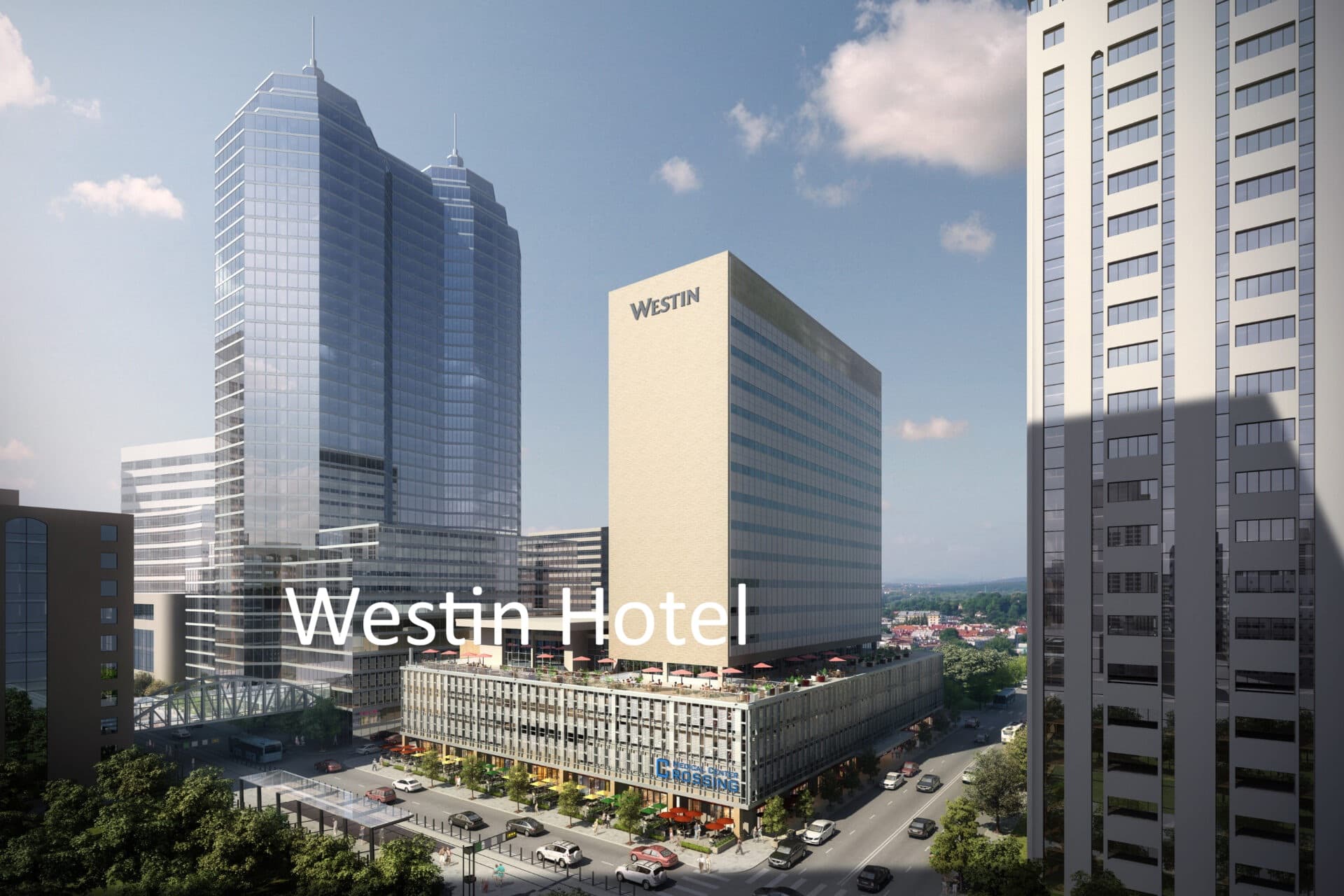 Modern Westin Hotel building and glass skyscraper overlooking a busy city street with traffic.